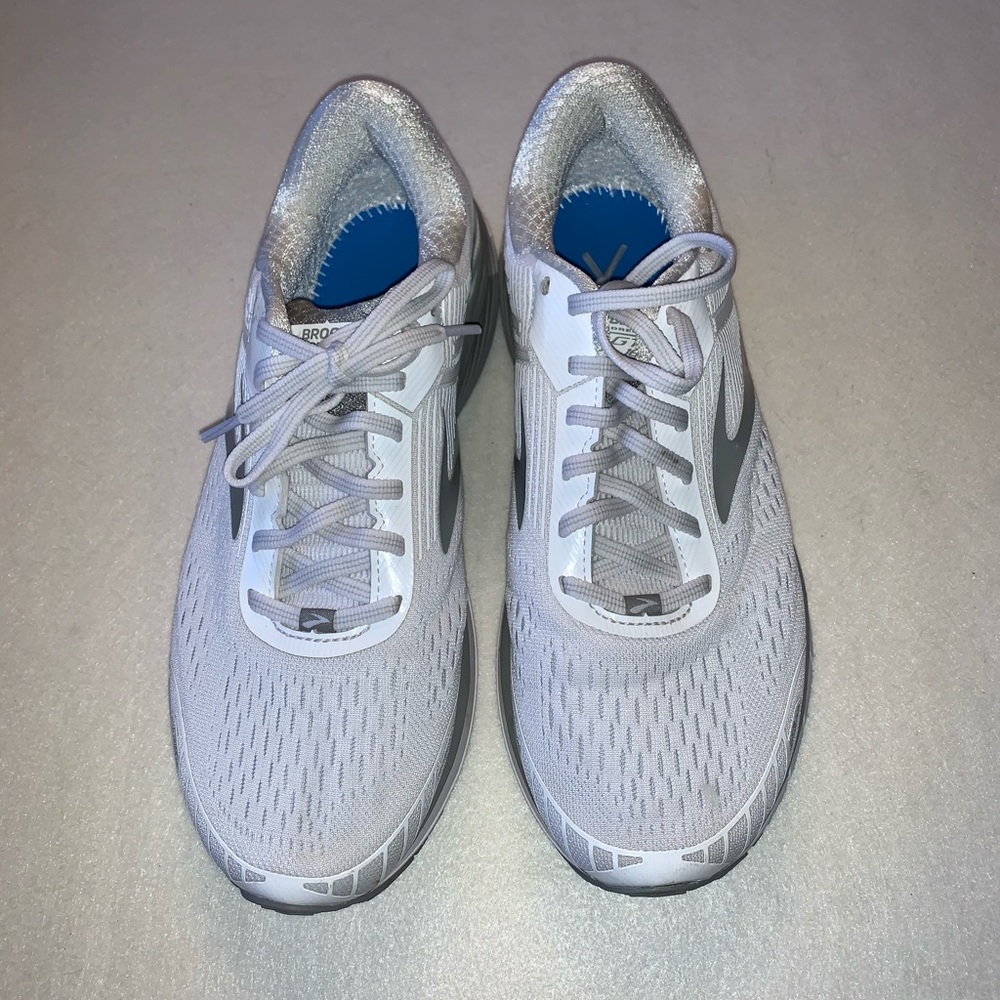 White Brooks sneakers.